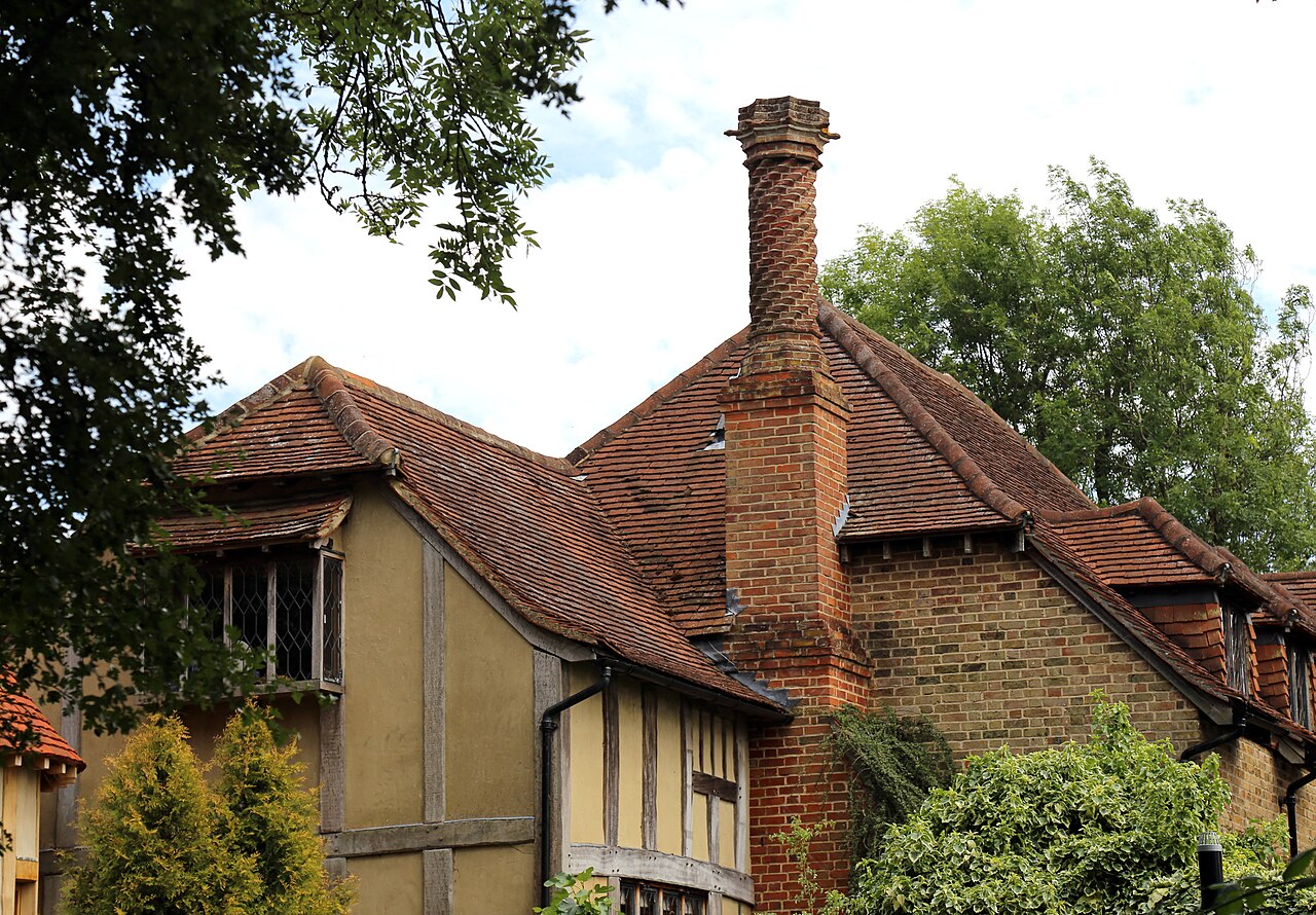 Traditional red clay-tile roof and brick chimney on a house in Essex, England